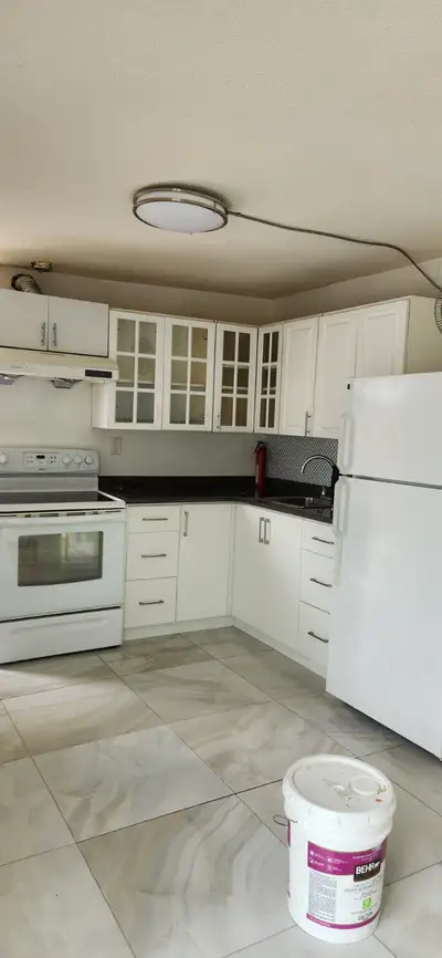 This unit is located at the back of a house. - Above ground - Private entrance - Full kitchen & bath...