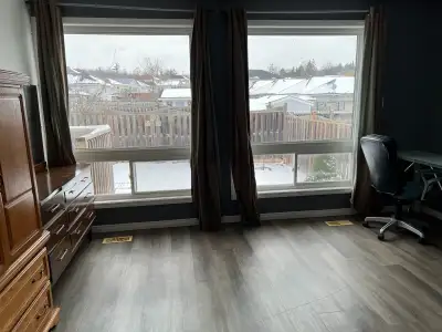 Large bedroom on main floor, shared washroom and kitchen with other roommates, all inclusive , furni...