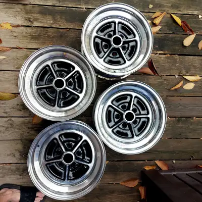 These rims came off of a 1987 Buick Station Wagon. The stamps on them reads, 6 02 79 15x7 JJ T 903 M...