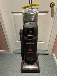 Hoover Vacuum with attachments and extra bags