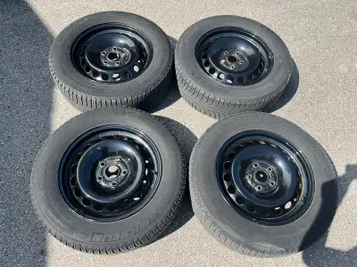 Set of four Michelin x ice winter tires on VW rims off a 2013 Volkswagen Passat. 215/60/16. Good con...