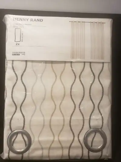 These are a set of two Ikea Henny Rand curtains, each measuring 145 cm by 250 cm. They feature a sty...