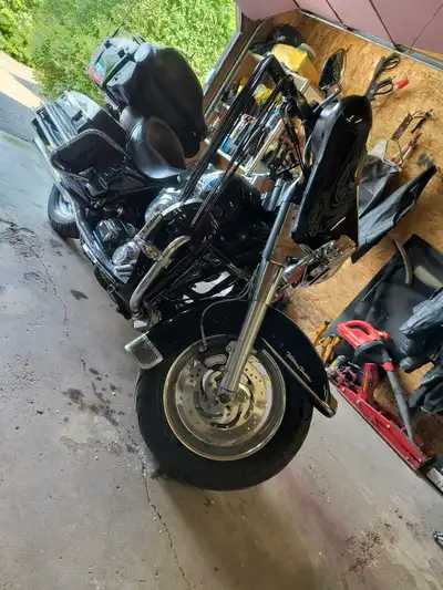 New paint. Color changed from blue to hi gloss black. Comes with tour pack, am/FM/cd player, saddle...