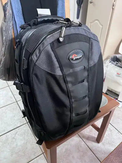 I'm selling a Lowepro backpack in great condition. It's a versatile and durable bag perfect for phot...