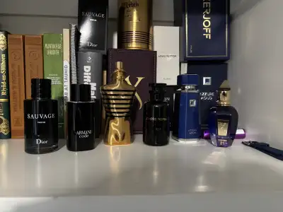 This is a collection of various cologne decants, ideal for sampling high-end fragrances before commi...