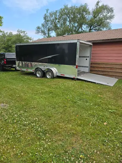Wells Cargo Trailer. New tires, 7000 lbs GVW loaded. Ramp and side door. $8,000 firm. Serious inquir...