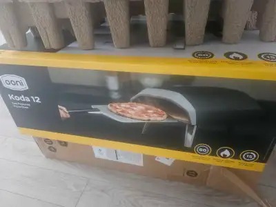 New ooni koda 12 gas powered oven. Used only once. Comes with 2 manual books, brick tray and peel pi...