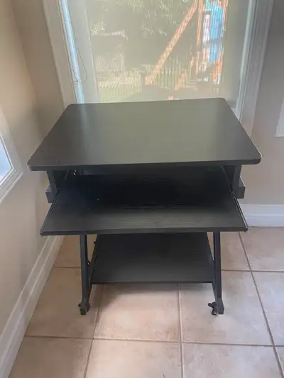 Small black computer desk with keyboard tray., View more