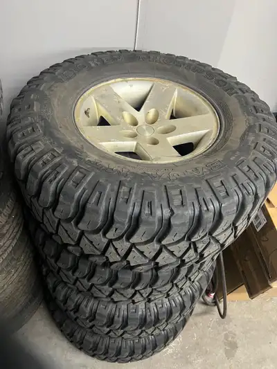 Set of 4 TJ Rubicon wheels with Mickey Thompson Baja MTZ tires Good shape no bends, cracks 305/70/16...