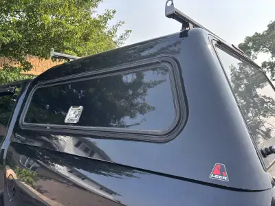 Good condition Heavy Duty topper with locking mechanical storage units, reinforced top and heavy loa...