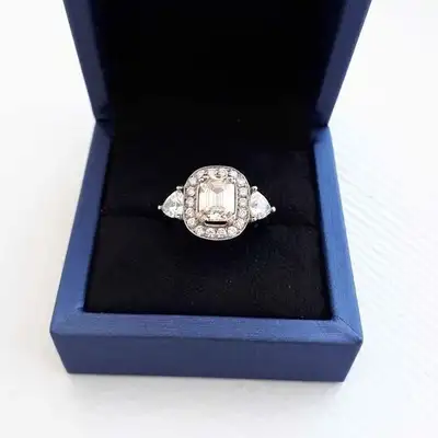 IF THE AD IS UP, it's available. BRAND NEW ... Custom designed stunning emerald cut moissanite engag...