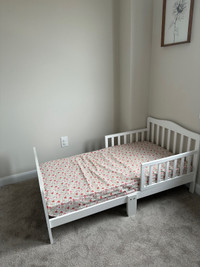 Toddler bed with new mattress (cover included) 