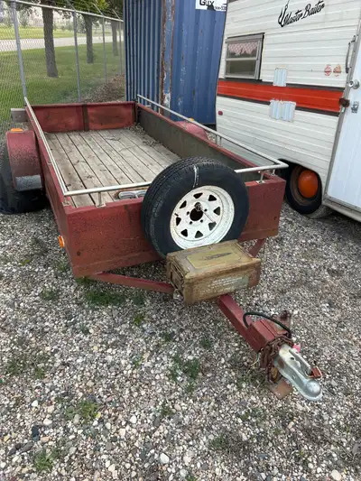 This is a used utility trailer, perfect for hauling your gear. Approximate Deck Dimensions: * Length...