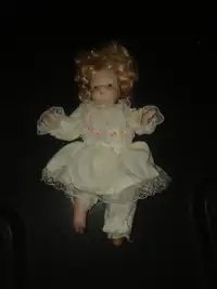 Small porcelain doll - damaged