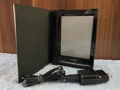 Sony PRS-T1 6" Digital E-Ink Pearl Black eReader w/ 2GB Mem. Card Bundle Small smudge near top left...