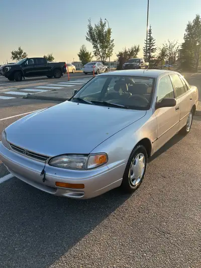 Reliable and well-maintained Camry with only 155,000 km. Runs smooth, A/C works, and remote starter...