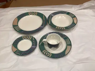 This is a large set of Mikasa dinnerware with a unique design, 14- 5 piece place setting plus 8 coff...