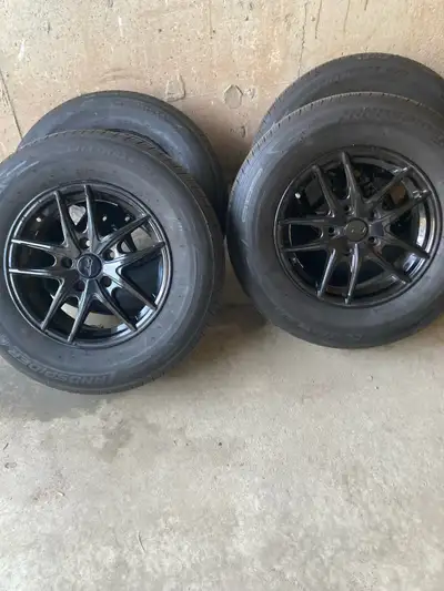 Set of four tires Landspider Citytraxx G/P, size 215/70R15, on rims. These are all-season performanc...