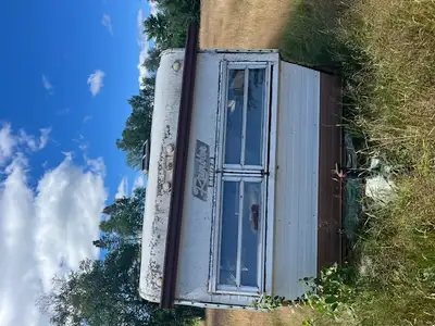 Free scrap camper and lawn tractor., View more
