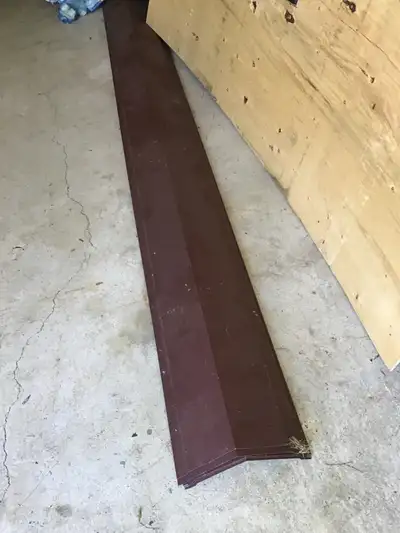 Four 10 ft sections of 7.5 “ metal roof cap . Never used. Brown in colour but can be repainted to su...
