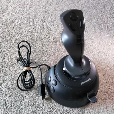 The Microsoft SideWinder is a legendary series of PC joysticks (starting in 1995) known for durable,...