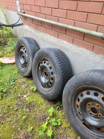 Used but not dead, 4 radial tires and rims from Motomaster/Canadian Tire. 185 / 70 R14 Trend wear an...