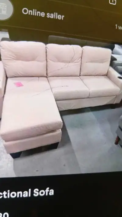 This is a sectional sofa, perfect for a living room. It's in used condition, with some wear and tear...