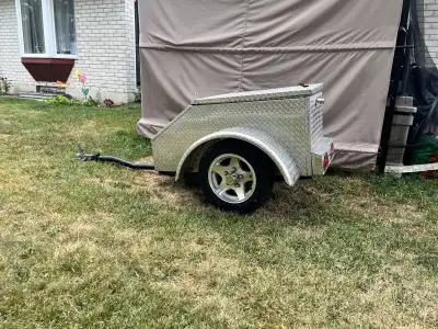 Can be towed by a car, truck, or motorcycle.