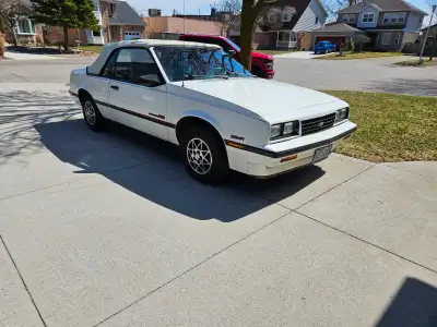 Clean 1987 Chevrolet Cavalier RS convertible has a white exterior with a matching white soft top. Th...