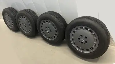Offering a set of four P205/65R15 tires mounted on rims, perfect for classic cars from the 70’s to t...