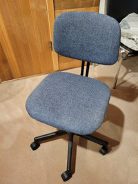 Swivel style small utility desk chair
