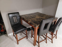 Faux marble pub style dining table with 3 chairs only.