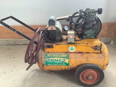 Comet portable air compressor. Model B49. ¾ hp motor, 25’ air hose. Tank bottom re-skinned. Runs wel...