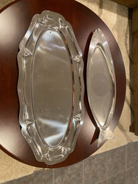 two large stainless steel oval platers
