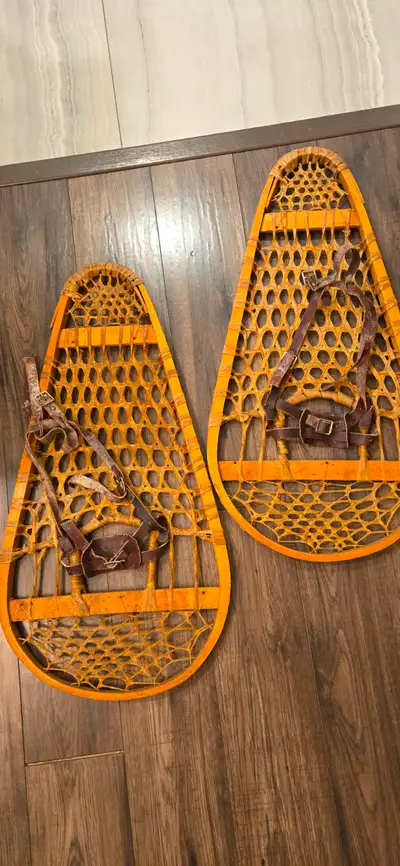 Traditional wood and rawhide snowshoes, View more