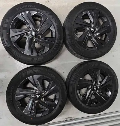 Set of 4 Hyundai Elantra OEM rims with All Season Tires good condition tires has lots of treads off...