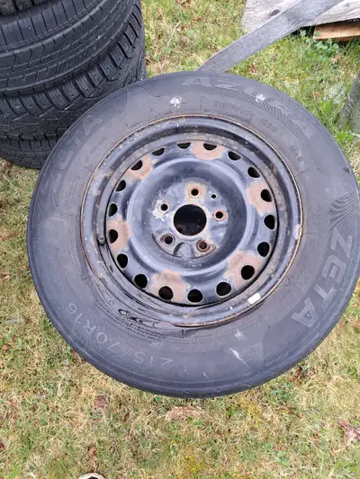 Have 2 dodge rims off a caravan, with tires, still some life left, wore on one side, asking 60$ obo...