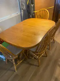 Double pedestal oak table with 3 leaves & 6 chairs