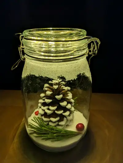 NEW - A peaceful snowy pine scene captured in a classic Hermes jar. The jar is 8.5 inches tall x 5 i...