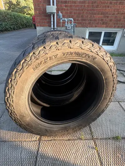Rugged Mickey Thompson Baja ATZ P3 all-terrain tires. These are size LT285/55R20 with a Load Range E...