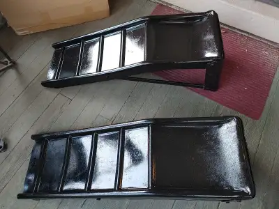 Rent a set of car ramps for 5$ a day and you can change your own oil, or any other repairs underneat...
