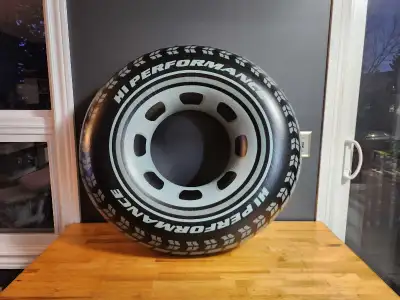 Intex Monster Truck Tube pool float. The inflatable tube is designed to look like a large tire, comp...