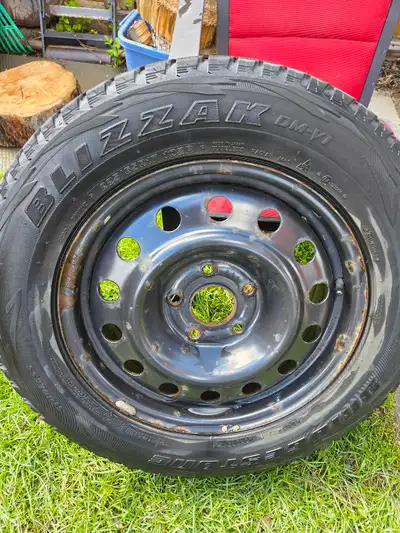 Blizzak tires with some life left on steel rims. Came from Grand Caravan