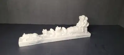 Vintage resin figurine of an Inuit dog sled made in Canada by Pearlite Marblecraft. Features a hunte...
