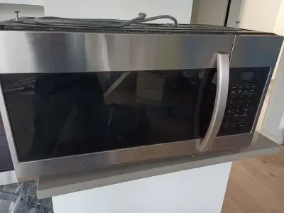 Good as new, over-the-range microwave. Works perfectly. Includes wall support. Willing to deliver lo...