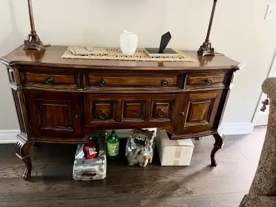 This antique hutch, with dimensions of 65 inches in length, 21 inches in depth, and 38 inches in hei...