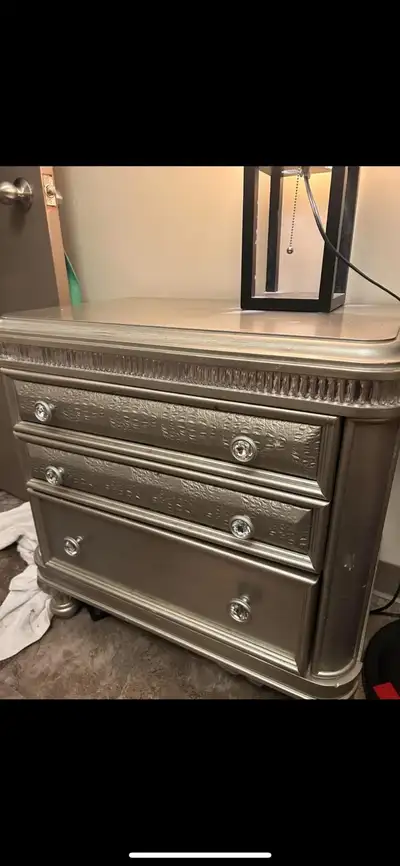 Selling silver/grey king size bed frame/head board with two end tables owned 4 yrs. Was new when bou...