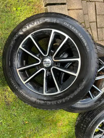 4 Firestone Destination LE3 all season tires with Dodge aluminum rims. Size 225/65R17. Purchased in...