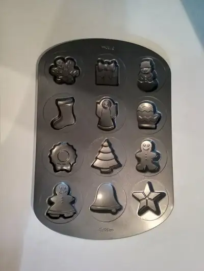 1. Christmas cookie pan - never used 2. Halloween cookie pan - never used 3. 24 small muffin pan - u...