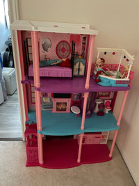 Barbie house with dolls and accessories